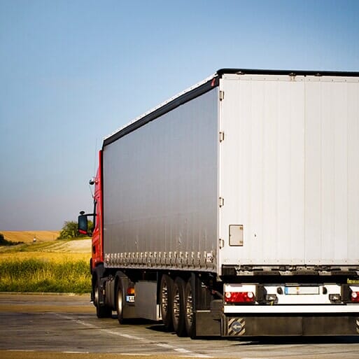 Freight trailer on a road from the Contact page